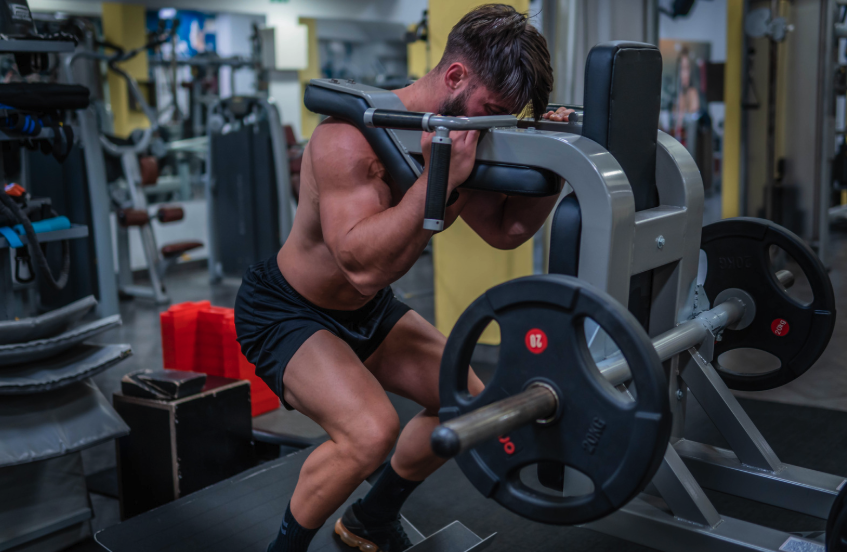 man doing a hack squat