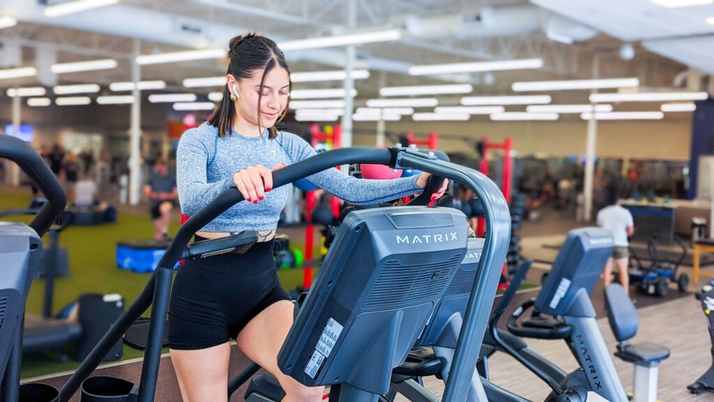 Woman uses stair climber machine