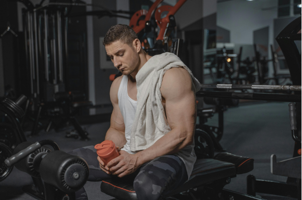 Man hydrating at the gym